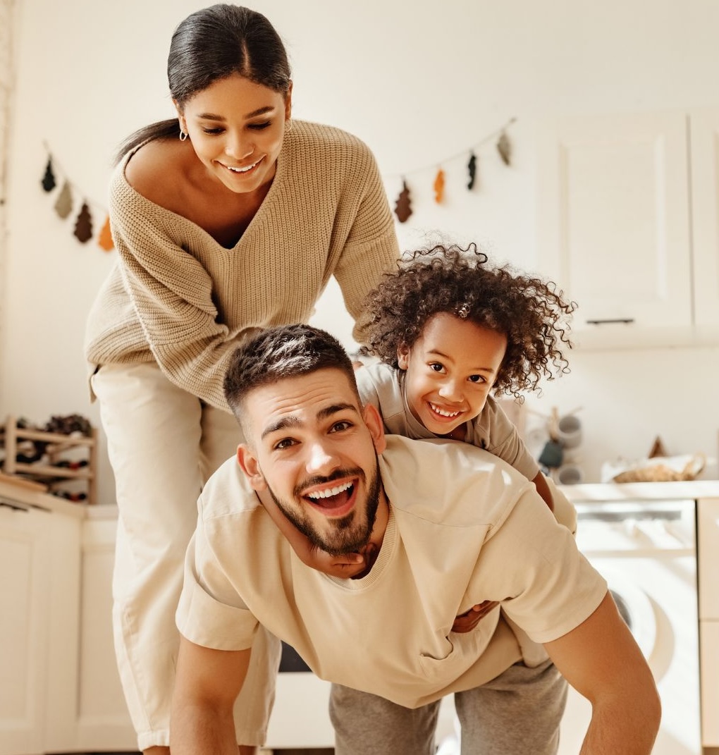 Happy mother, father, and daughter